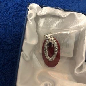 Beautiful pendant with silver and garnet detail